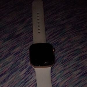 Apple Smartwatch with Gold Case and White Band